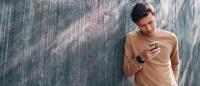 Young man using phone.